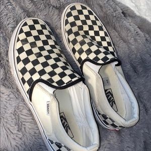 Black and white checkered slip on vans